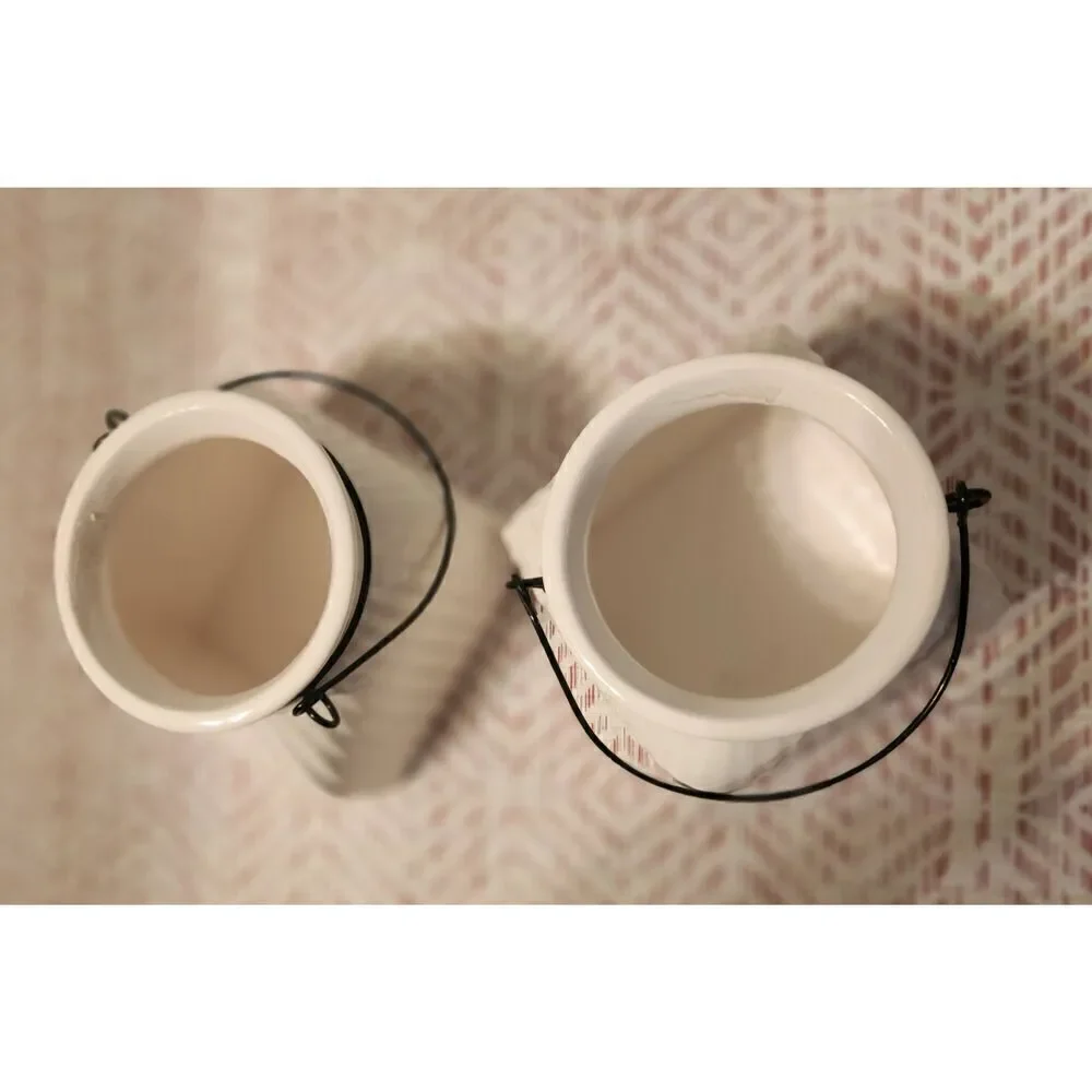 Napco cream ceramic jars with metal wire hangers